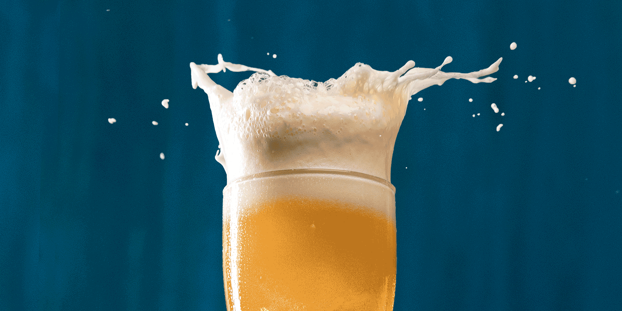 exploding glass of craft beer